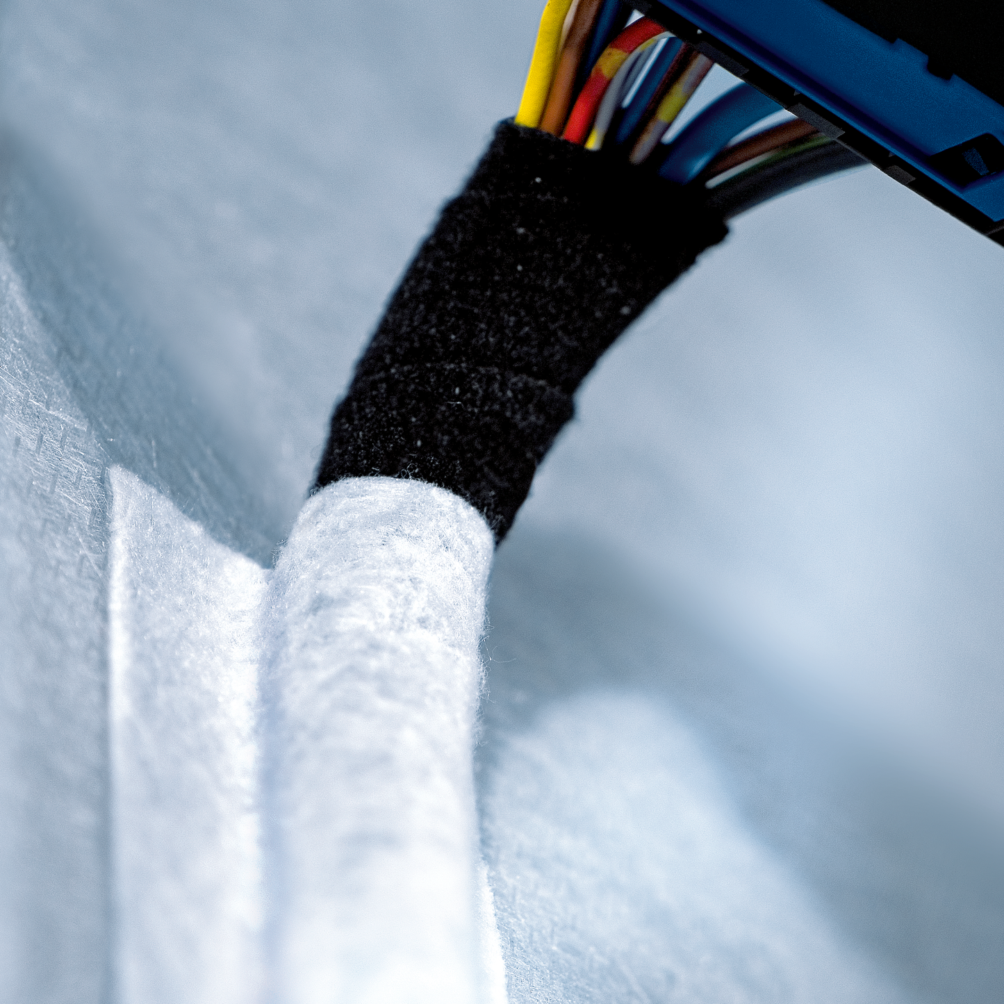 tesa® 50118PV2 540 µm modified acrylic adhesive with PET fleece backing for mounting application in automotive interiors - automotive cable-mounting-004.png