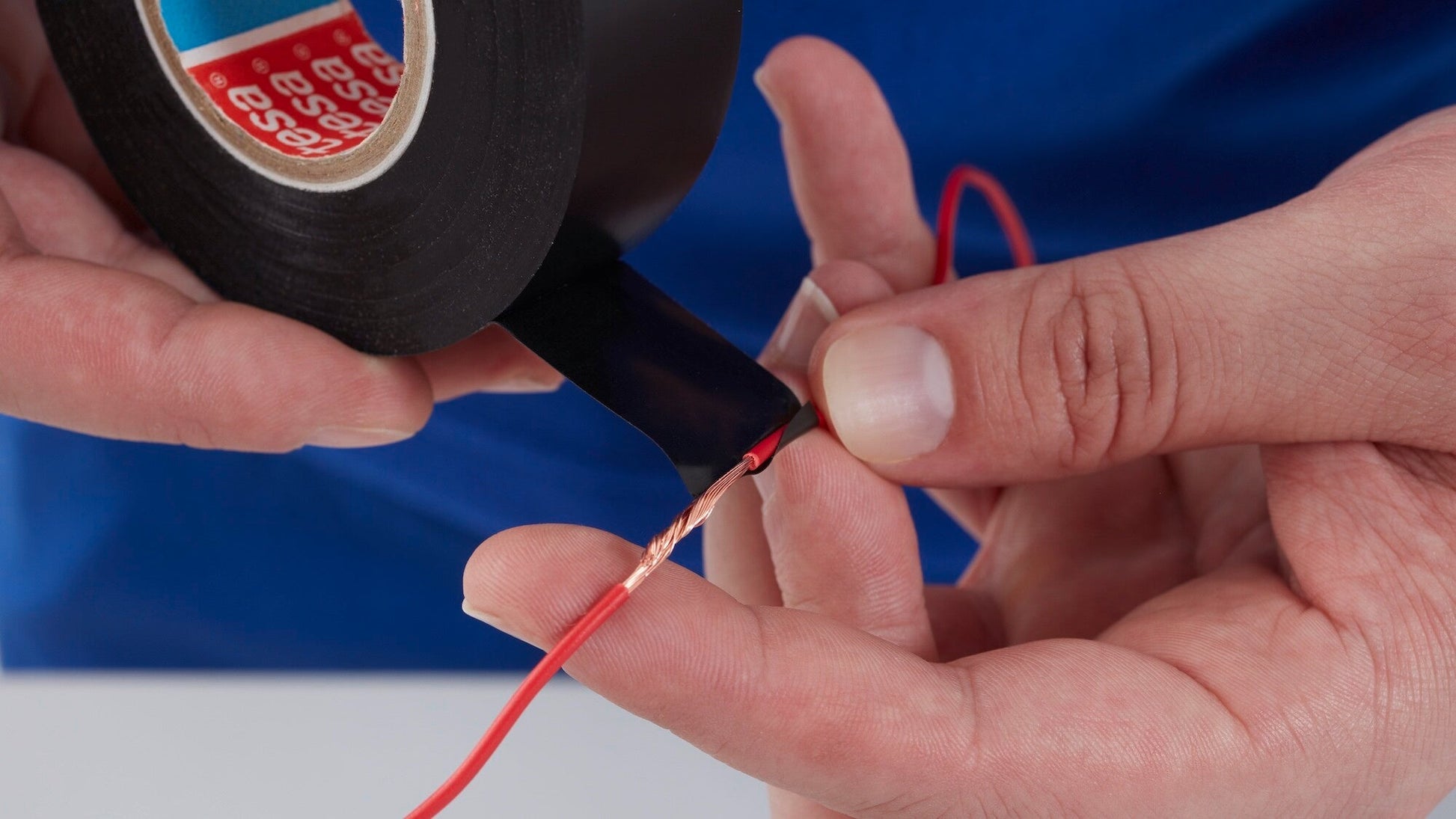 tesa® 4163 Premium Soft PVC Multipurpose Tape - tesa-4163-premium-soft-pvc-multipurpose-tape-black-step2of4-ap.jpg