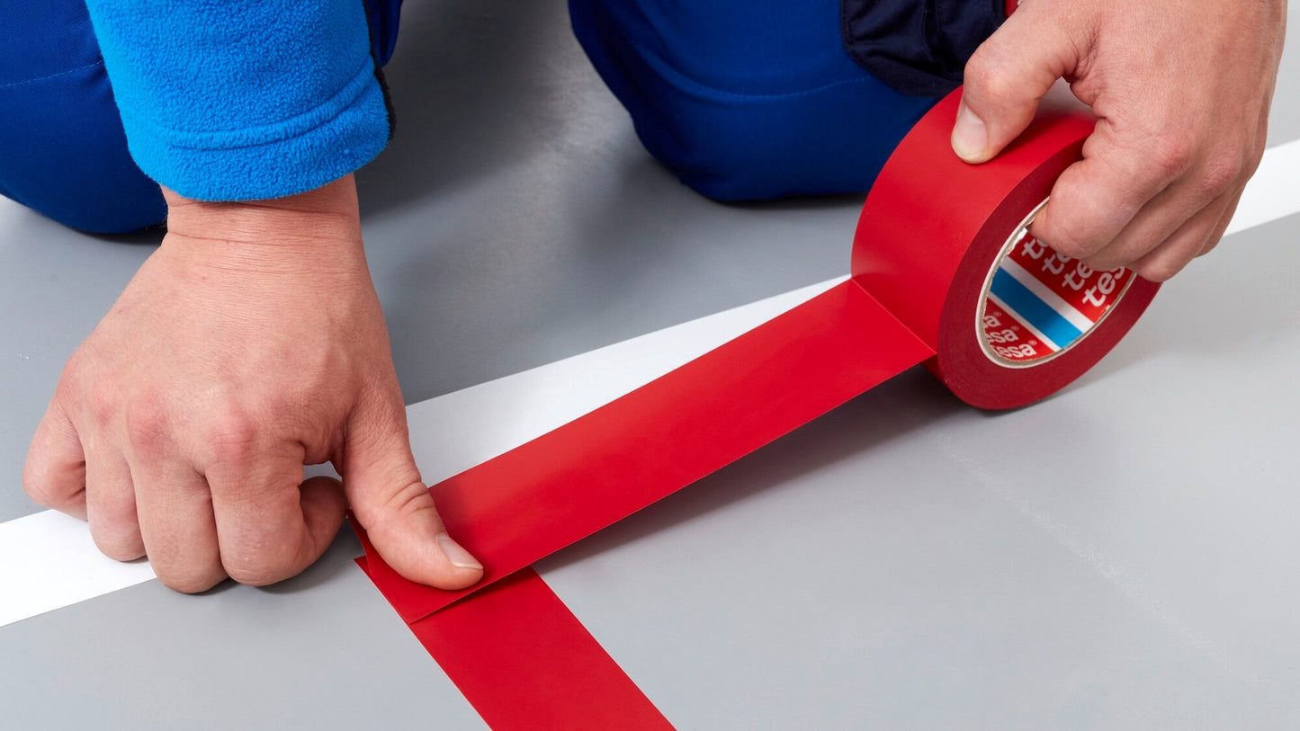 tesa® 4169 Premium Soft PVC Floor Marking Tape - tesa-4169-premium-soft-pvc-floor-marking-tape-red-step1of6-ap.jpg