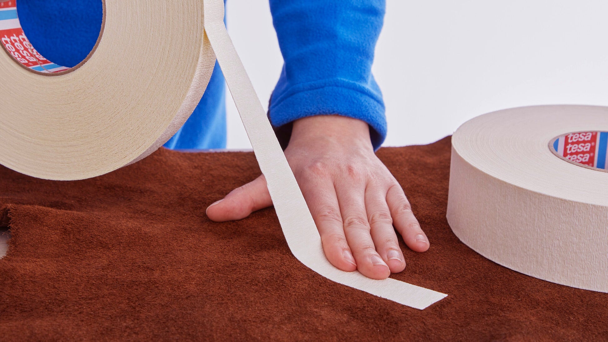 tesa® 4974 Double-sided tape with fabric backing - tesa-4974-double-sided-tape-fabric-backing-suede-leather-step1of2.jpg